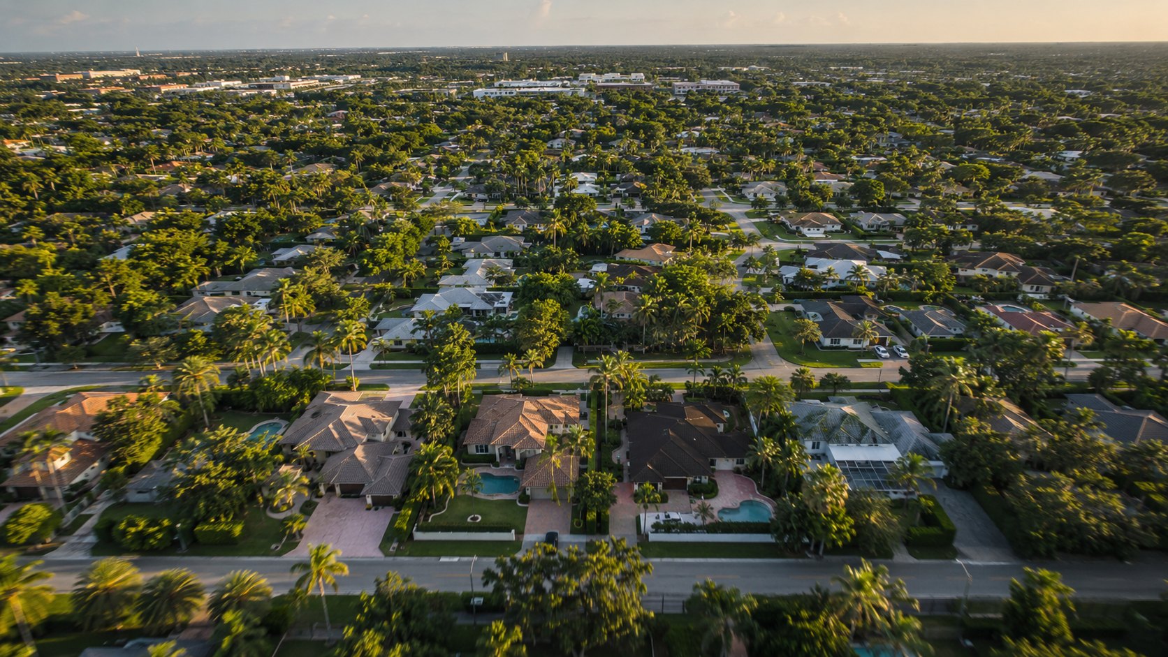 South Florida single-family neighborhood from the air at golden hour